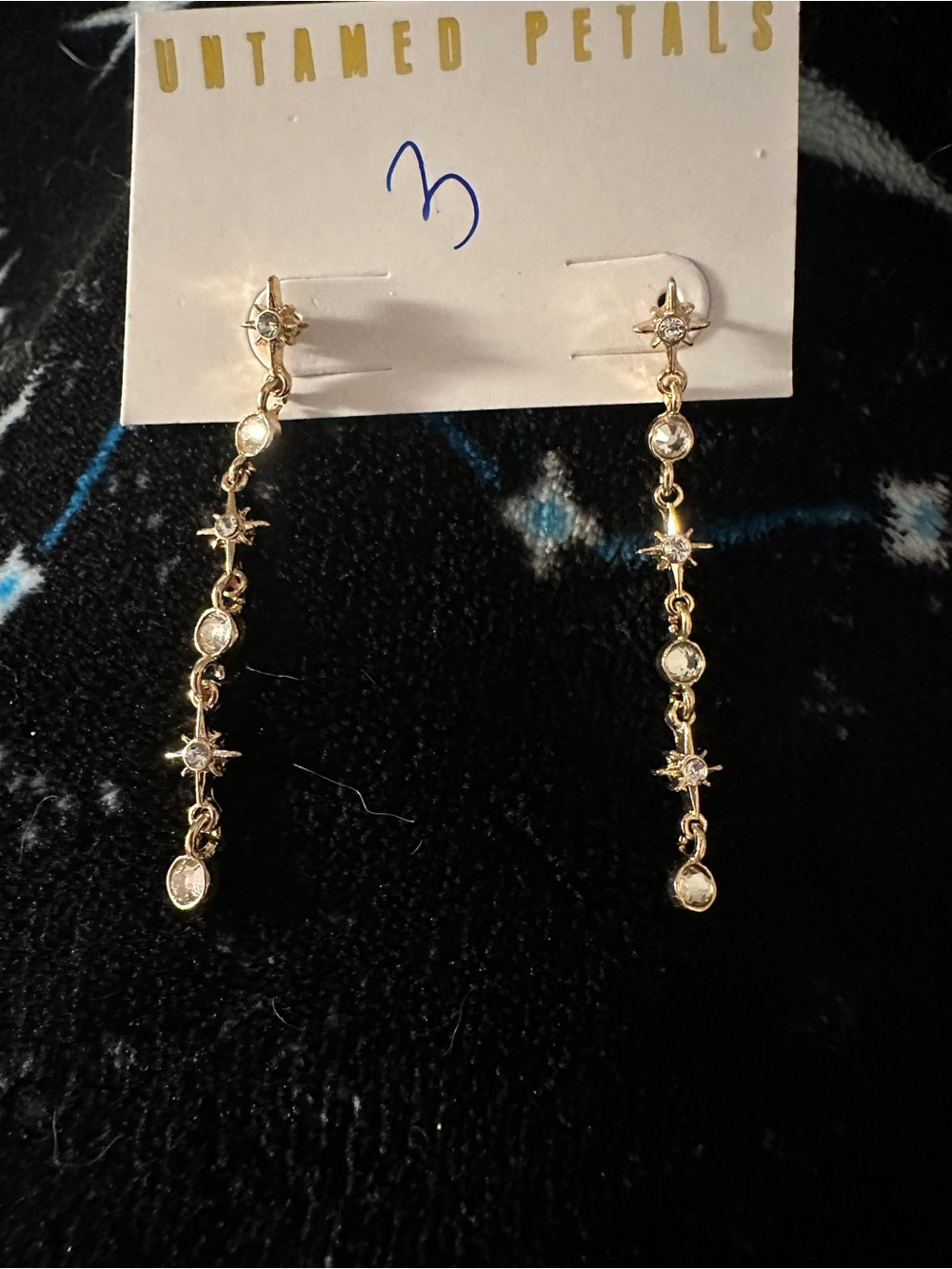 Untamed Petals Gold-Toned Linear Drop Earrings in a Celestial Starburst Design